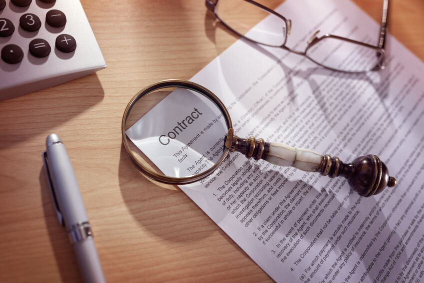 Magnifying glass on a legal document